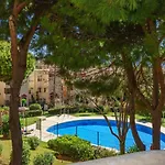 Riviera Charm: 2Br Retreat With Terrace Pool